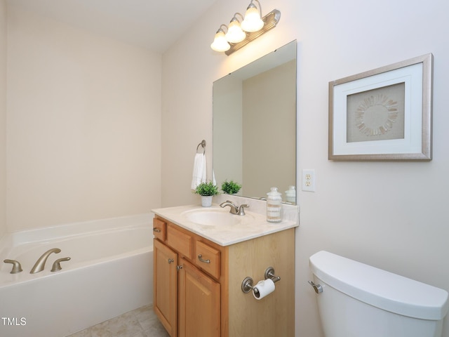 bathroom with a bath, vanity, toilet, and tile patterned floors