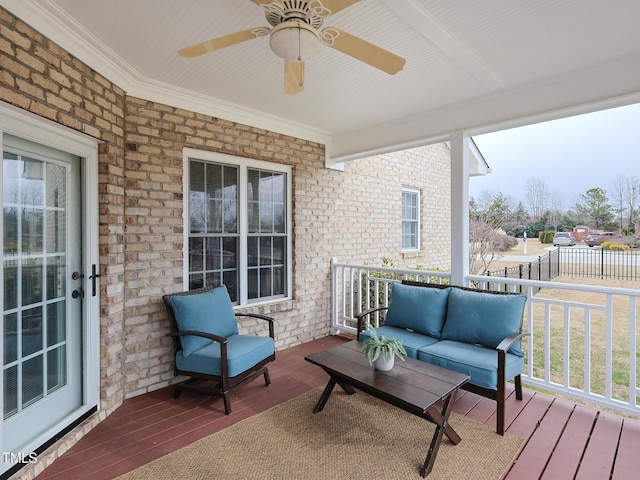 wooden terrace with ceiling fan and a porch