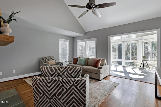 living area featuring plenty of natural light, baseboards, and light wood-style flooring