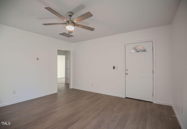 unfurnished room featuring ceiling fan and dark hardwood / wood-style flooring