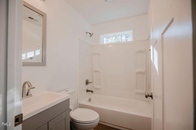 full bathroom with bathing tub / shower combination, vanity, and toilet