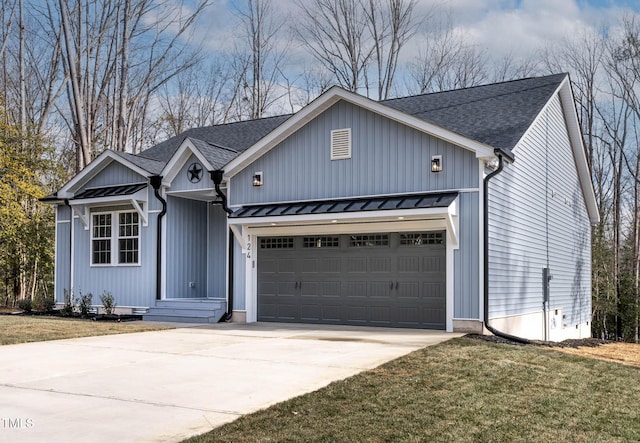 view of front facade with a garage and a front yard