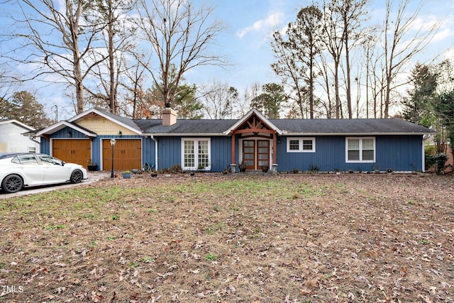 ranch-style house featuring a garage