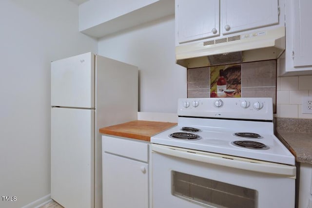 kitchen featuring decorative backsplash, white appliances, and white cabinetry