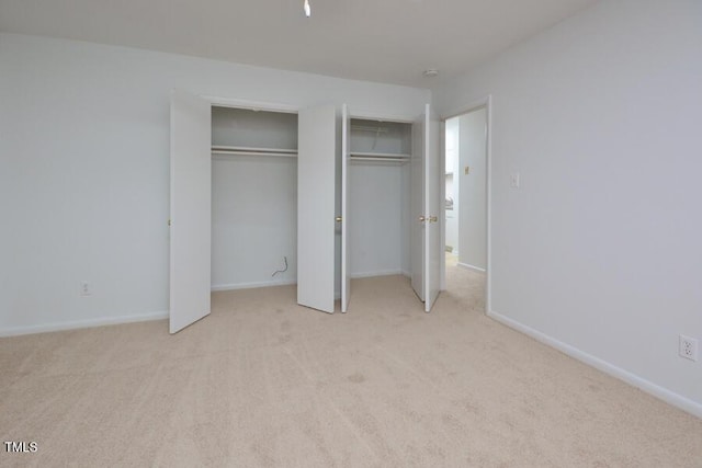 unfurnished bedroom with light carpet