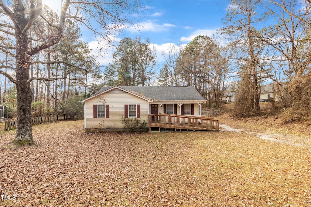 view of front of property with a deck and cooling unit