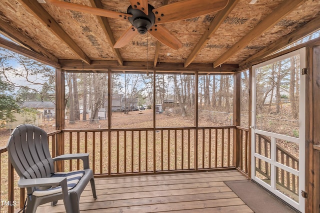 unfurnished sunroom with ceiling fan