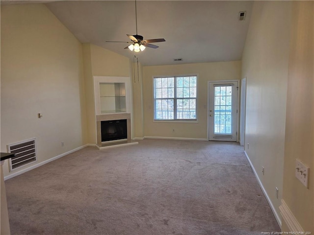 unfurnished living room with built in shelves, light carpet, ceiling fan, and high vaulted ceiling