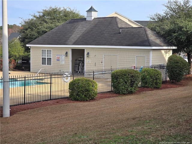 exterior space featuring a patio area and a community pool