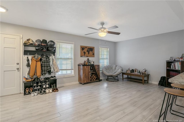 interior space with light hardwood / wood-style flooring and ceiling fan