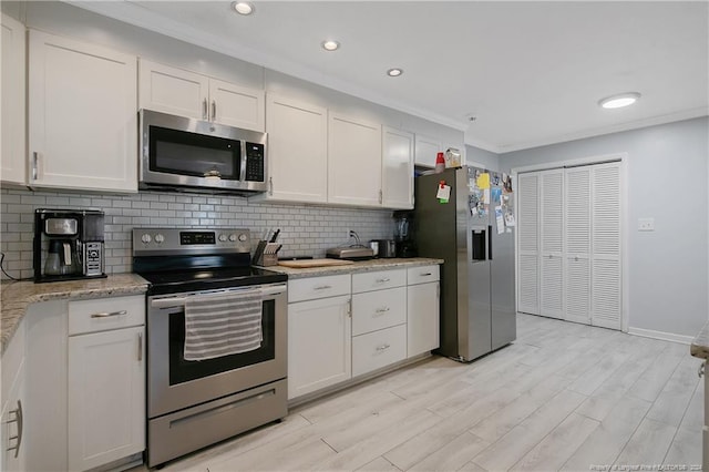 kitchen featuring white cabinetry and appliances with stainless steel finishes