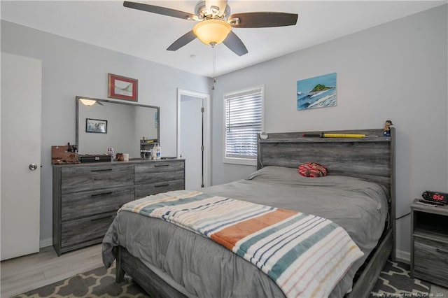 bedroom featuring light hardwood / wood-style floors and ceiling fan