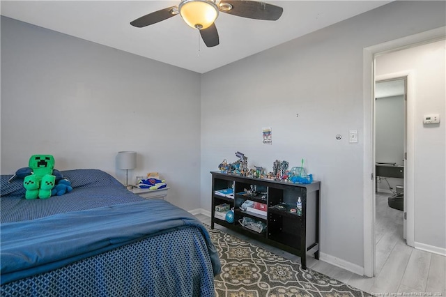 bedroom featuring light wood-type flooring and ceiling fan