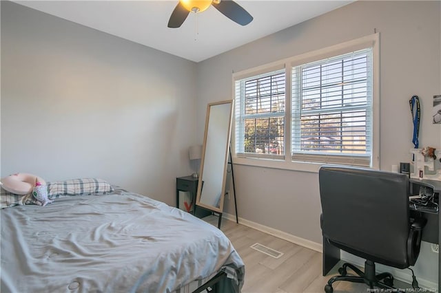 bedroom with ceiling fan and light hardwood / wood-style flooring