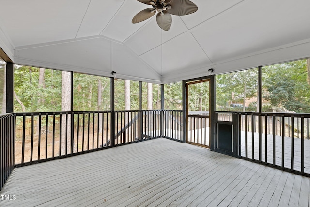 unfurnished sunroom with lofted ceiling and a ceiling fan