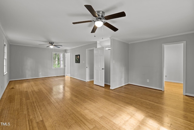 unfurnished living room featuring light wood-type flooring, crown molding, and baseboards