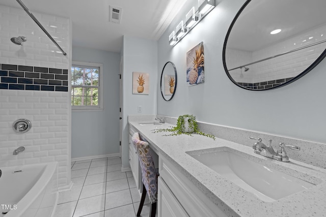 full bathroom with washtub / shower combination, visible vents, a sink, and tile patterned floors