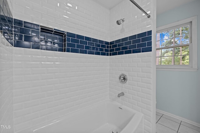 full bath with tile patterned flooring, baseboards, and shower / tub combination