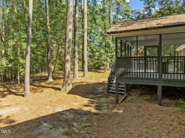 view of yard featuring a sunroom