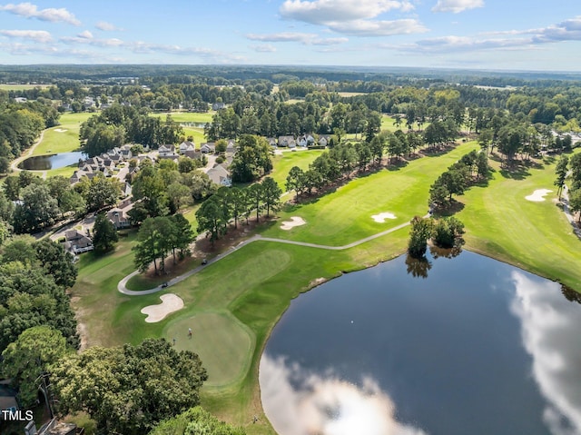 aerial view with golf course view and a water view