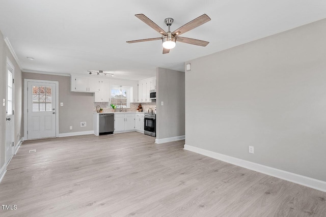 unfurnished living room with ceiling fan, light wood-type flooring, sink, and ornamental molding