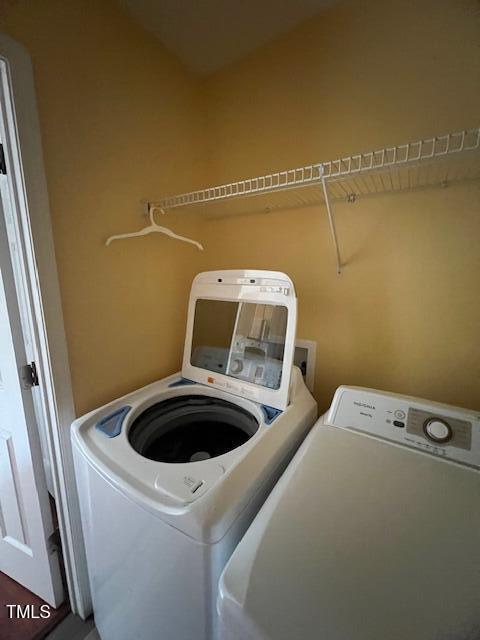 laundry area with washing machine and dryer