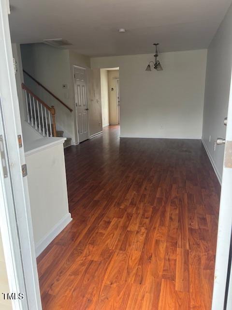 empty room featuring dark hardwood / wood-style floors