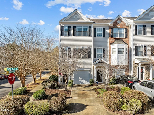 townhome / multi-family property featuring a garage