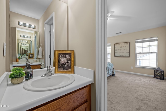 bathroom featuring vanity and ceiling fan