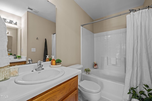 full bathroom featuring toilet, vanity, and shower / tub combo with curtain