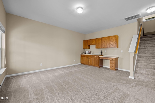 kitchen with light carpet