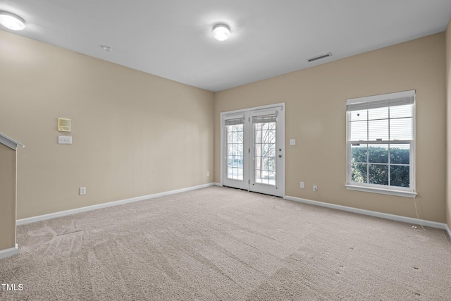 spare room with light carpet