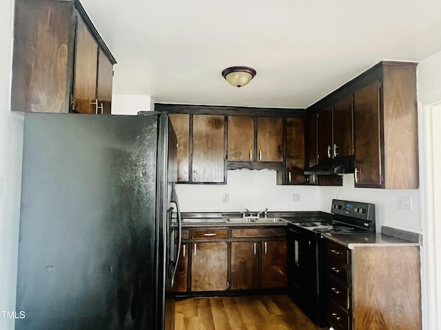 kitchen with sink, dark brown cabinetry, dark hardwood / wood-style floors, and black appliances