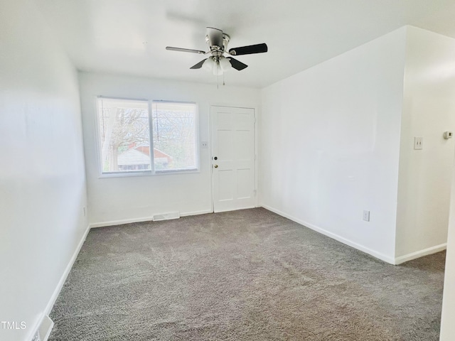 carpeted empty room with ceiling fan