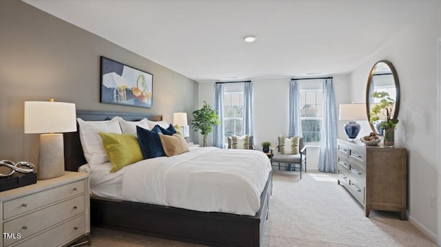 bedroom with light colored carpet