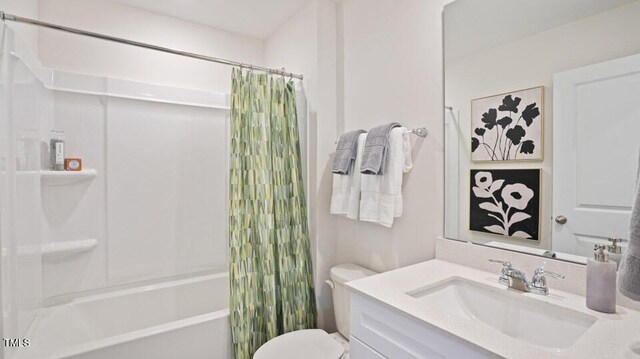 full bathroom with vanity, shower / bath combination with curtain, and toilet