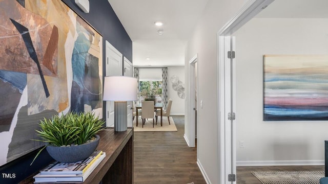 hall with dark wood-type flooring