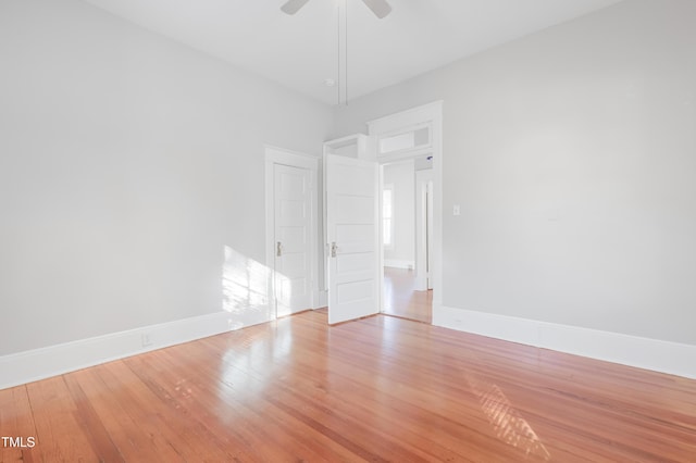 unfurnished room featuring ceiling fan and light hardwood / wood-style flooring