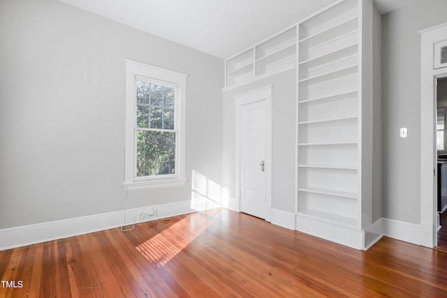 unfurnished bedroom featuring hardwood / wood-style floors