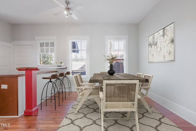 dining space featuring hardwood / wood-style floors and ceiling fan