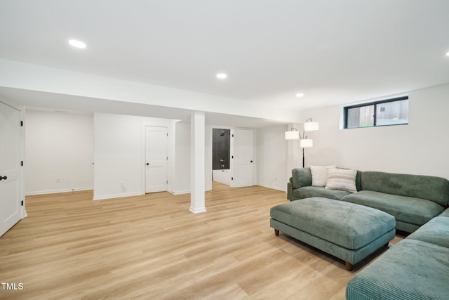 living room with light hardwood / wood-style flooring