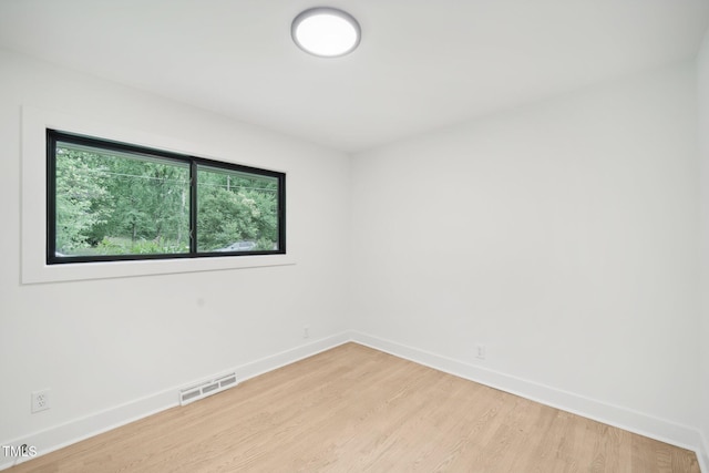 spare room with light wood-type flooring