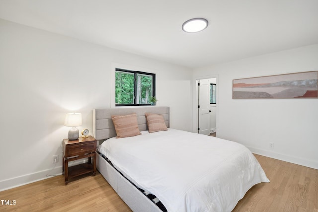 bedroom with light wood-type flooring