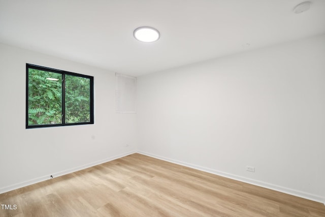 spare room featuring light wood-type flooring