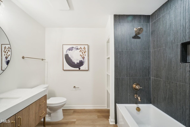 full bathroom with toilet, shower / washtub combination, wood-type flooring, and vanity