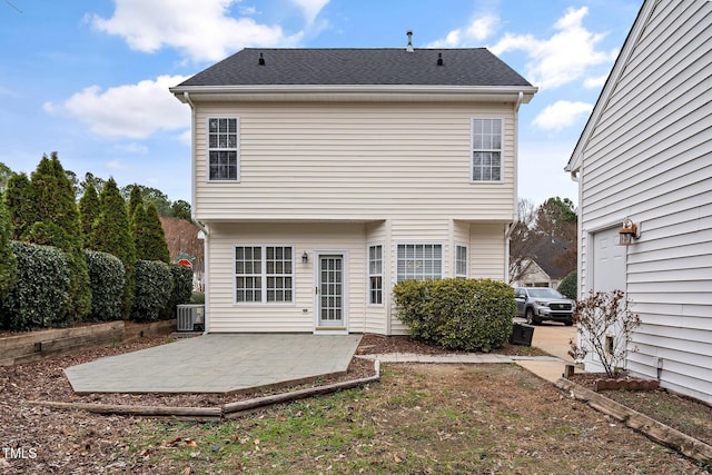 rear view of house featuring a patio area and central air condition unit