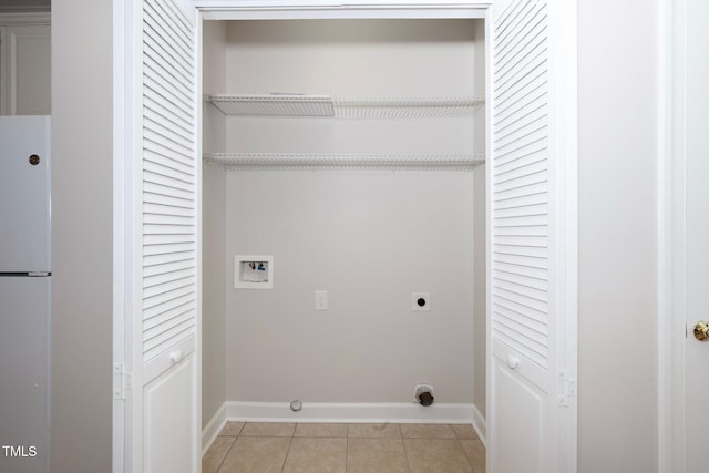 laundry room with washer hookup, electric dryer hookup, and light tile patterned floors