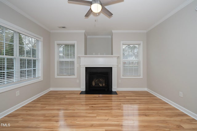 unfurnished living room with light wood-type flooring, ceiling fan, and crown molding