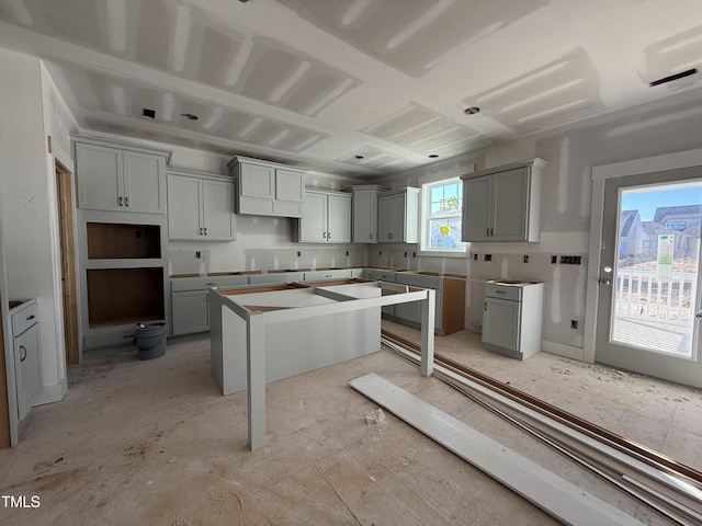 kitchen featuring a kitchen island and gray cabinetry