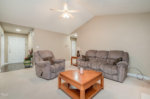 carpeted living room featuring ceiling fan and lofted ceiling